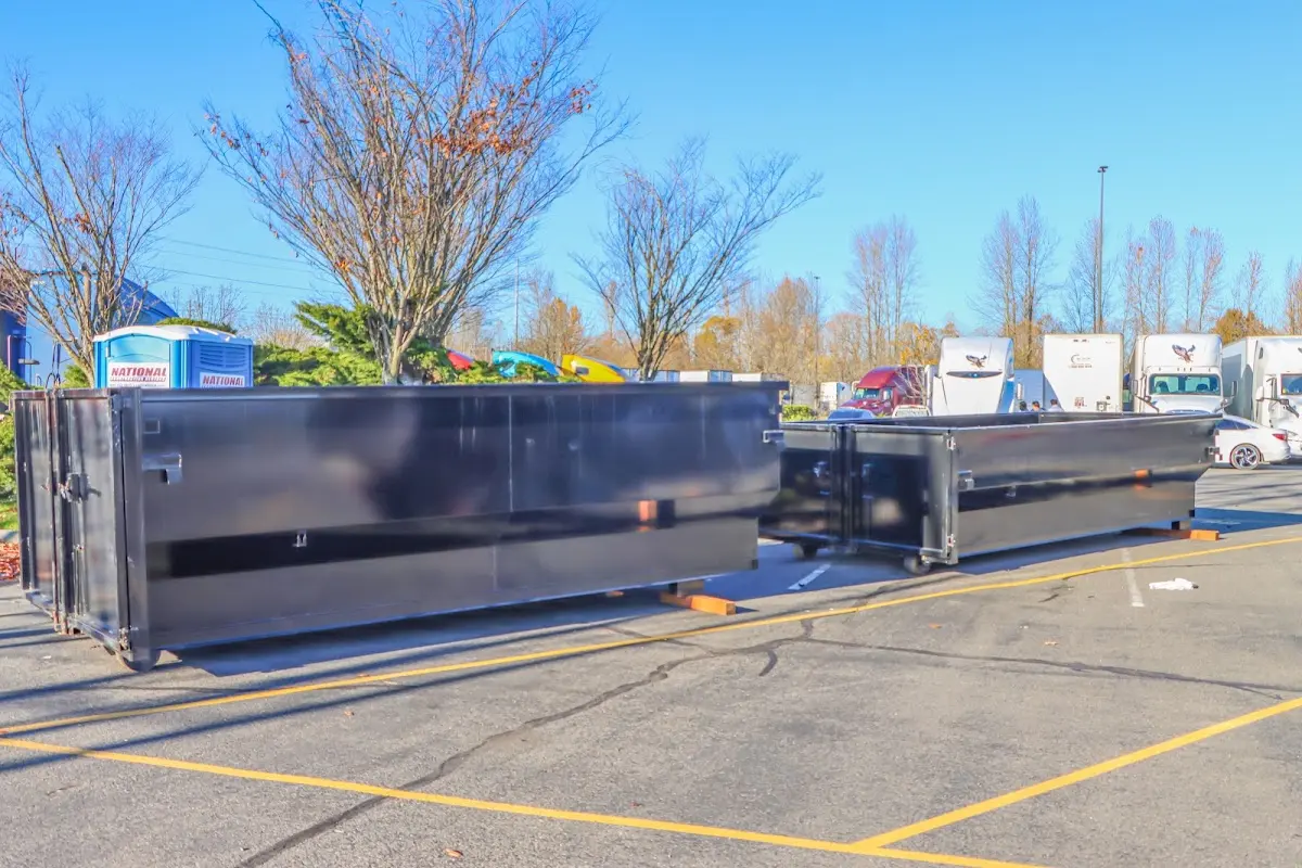 Professional dumpster rental service with roll-off container on residential driveway in Sebastopol